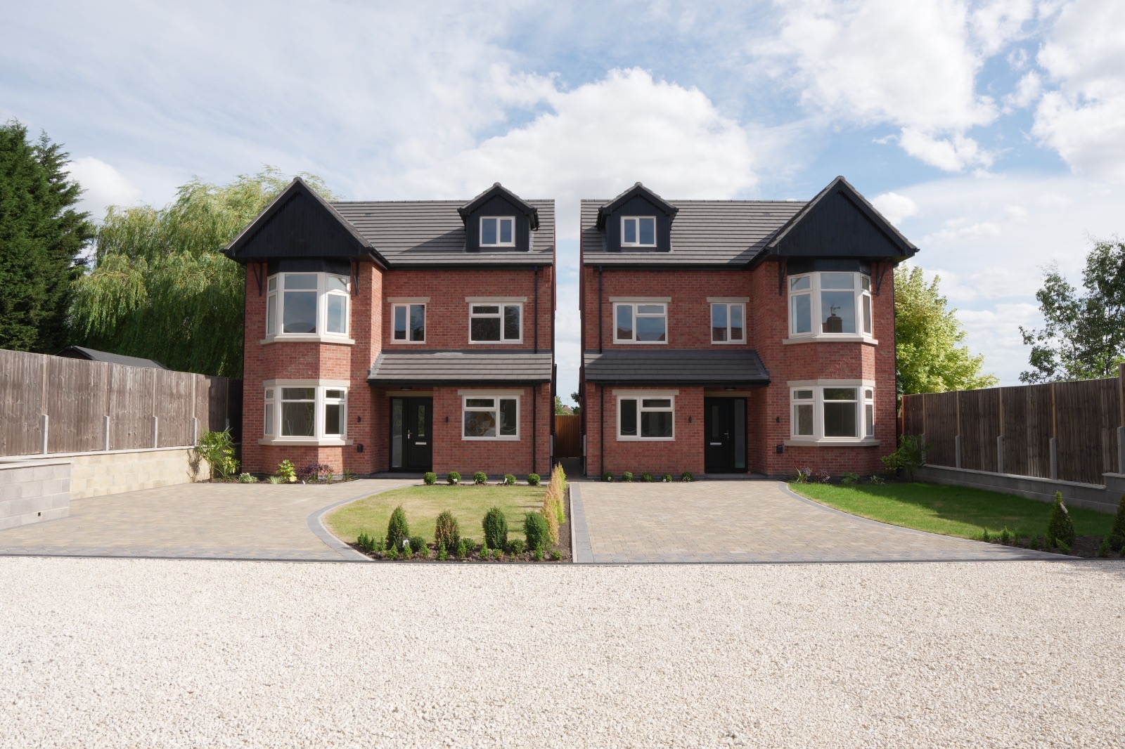 Pair of new-build houses supplied with composite doors and casement windows