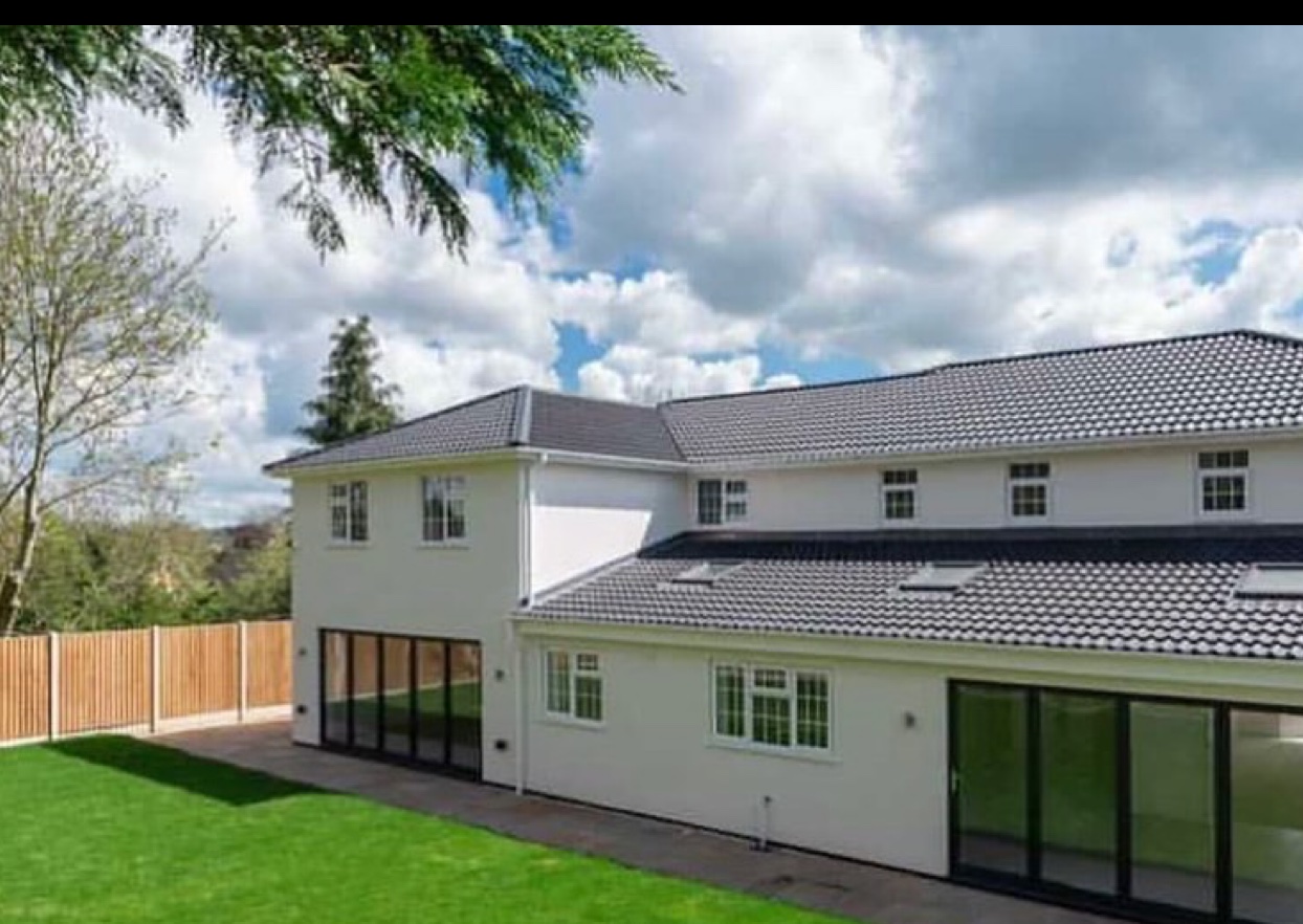 New-build rear elevation with bi-fold and sliding doors