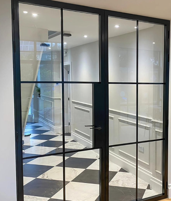 Internal steel-look double doors on checkerboard marble floor