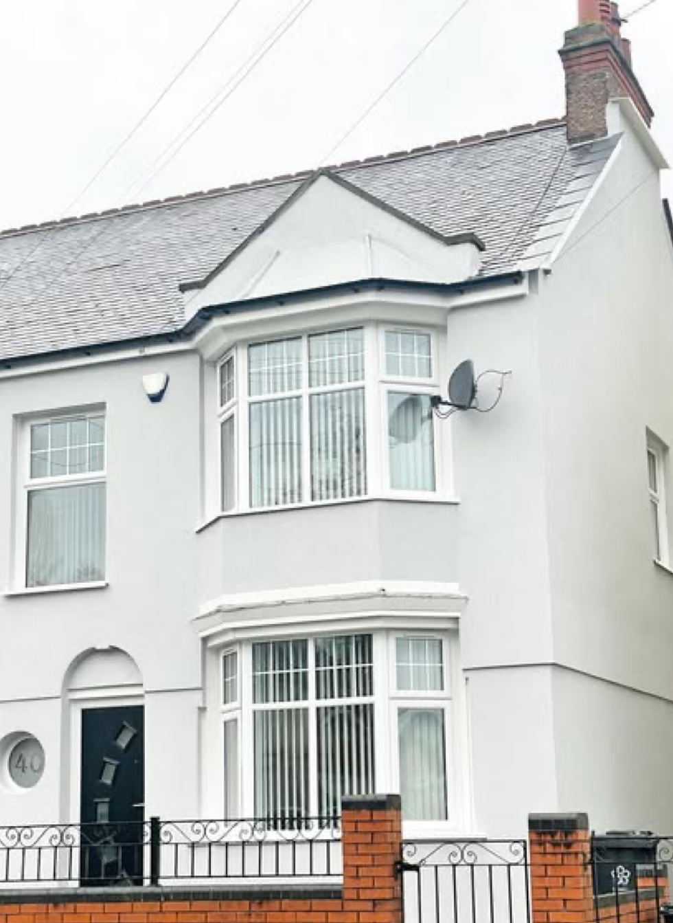 Rendered semi with bay windows and a black composite door