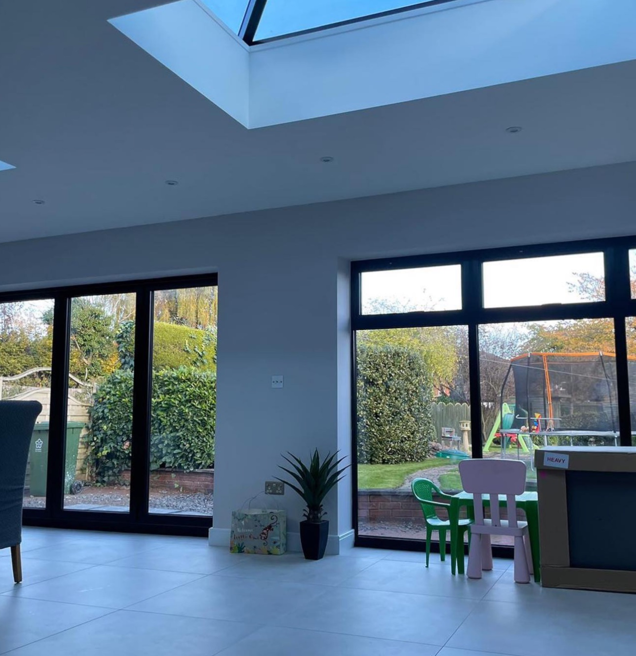 Extension interior with aluminium roof lantern, bi-fold doors and casement windows