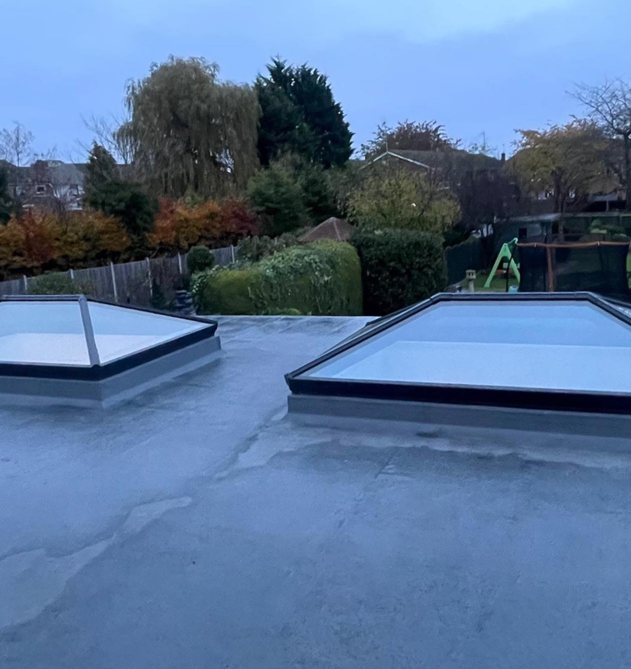 Two aluminium roof lanterns fitted on a flat extension roof